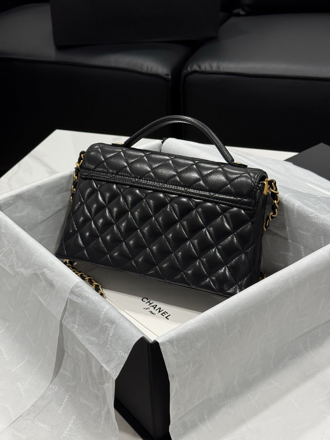 Chanel – Top Handle Flap Bag (Black Lambskin Leather)