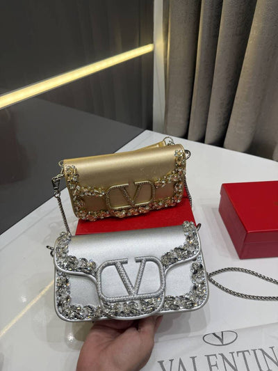 Valentino Garavani small Locò cross body bag hover